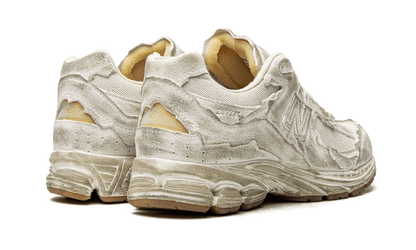 2002r-protection-pack-distressed-raven-sneakers